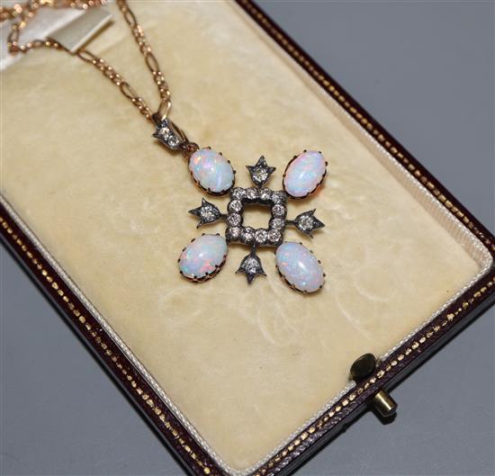 A late Victorian yellow and white metal, white opal and diamond set quatrefoil pendant, on a later yellow metal chain, pendant 38mm.